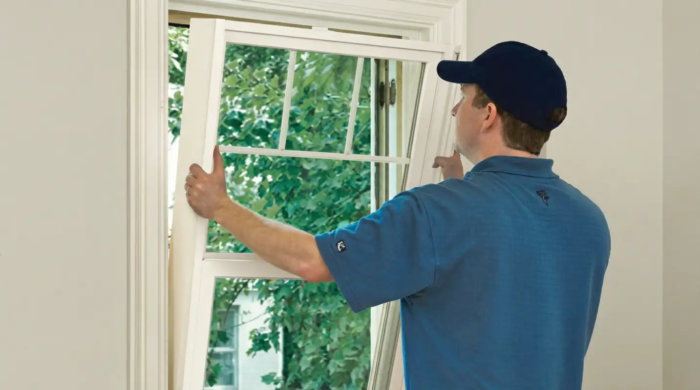 Professional contractors performing a residential window insulation and replacement service in San Antonio, TX